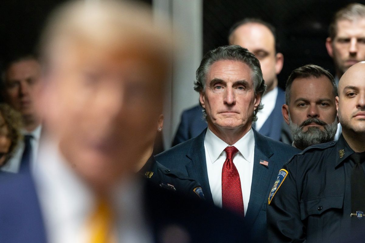 Governor Doug Burgum (C) of North Dakota listens as former U.S. President Donald Trump (L) speaks to reporters at the end of the day's proceedings in his criminal trial for allegedly covering up hush money payments at Manhattan Criminal Court on May 14, 2024 in New York City. (Justin Lane - Pool/Getty Images)