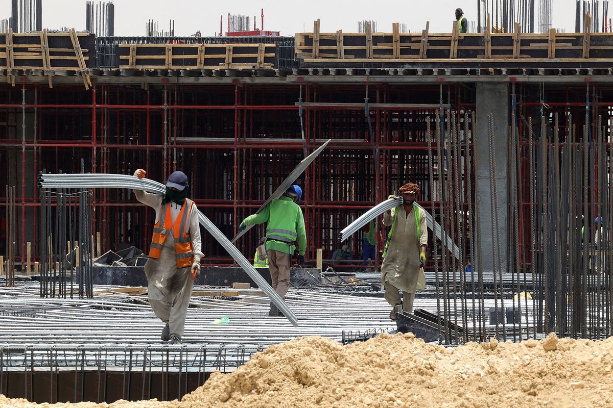Foreign labourers work at a construction site amid scorching heat in the Saudi capital Riyadh, on June 16, 2022. (FAYEZ NURELDINE/AFP via Getty Images)