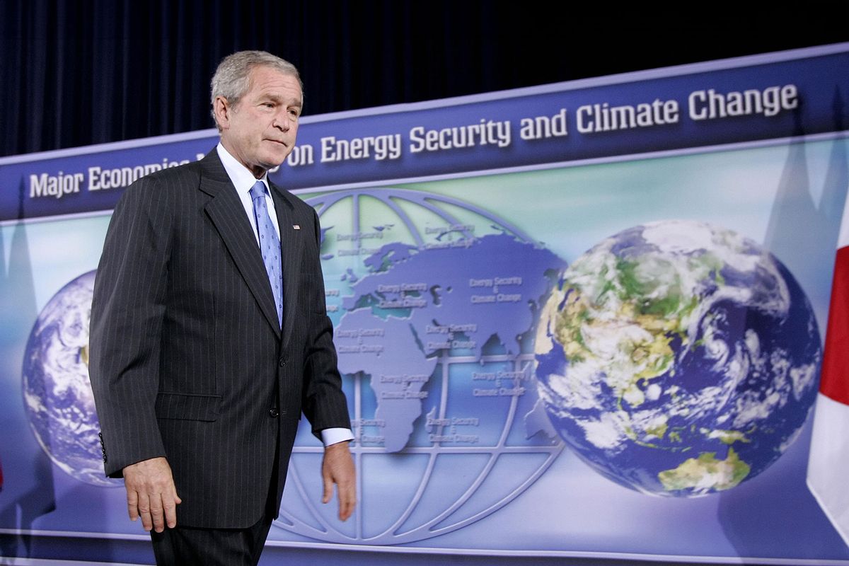 US President George W. Bush walks off the stage after speaking on climate change during a Major Economies Meeting on energy, security and climate change at the State Department in Washington, DC, 28 September 2007. (SAUL LOEB/AFP via Getty Images)