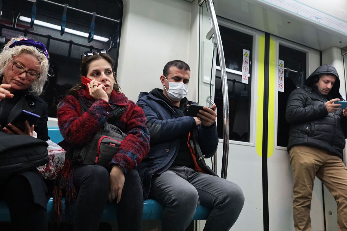 A man in the metro wears a medical mask for protection in Istanbul on February 3, 2024. (ILKER ERAY/Middle East Images/AFP via Getty Images)