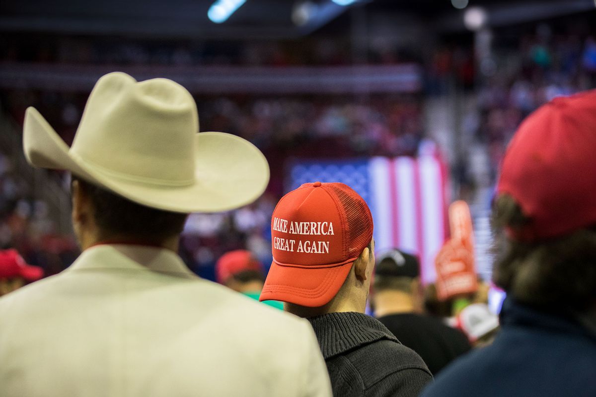 MAGA hat and a cowboy hat worn by President Donald Trip supporters at a rally in Houston, Monday, Oct. 22, 2018. (Marie D. De Jesus/Houston Chronicle via Getty Images)