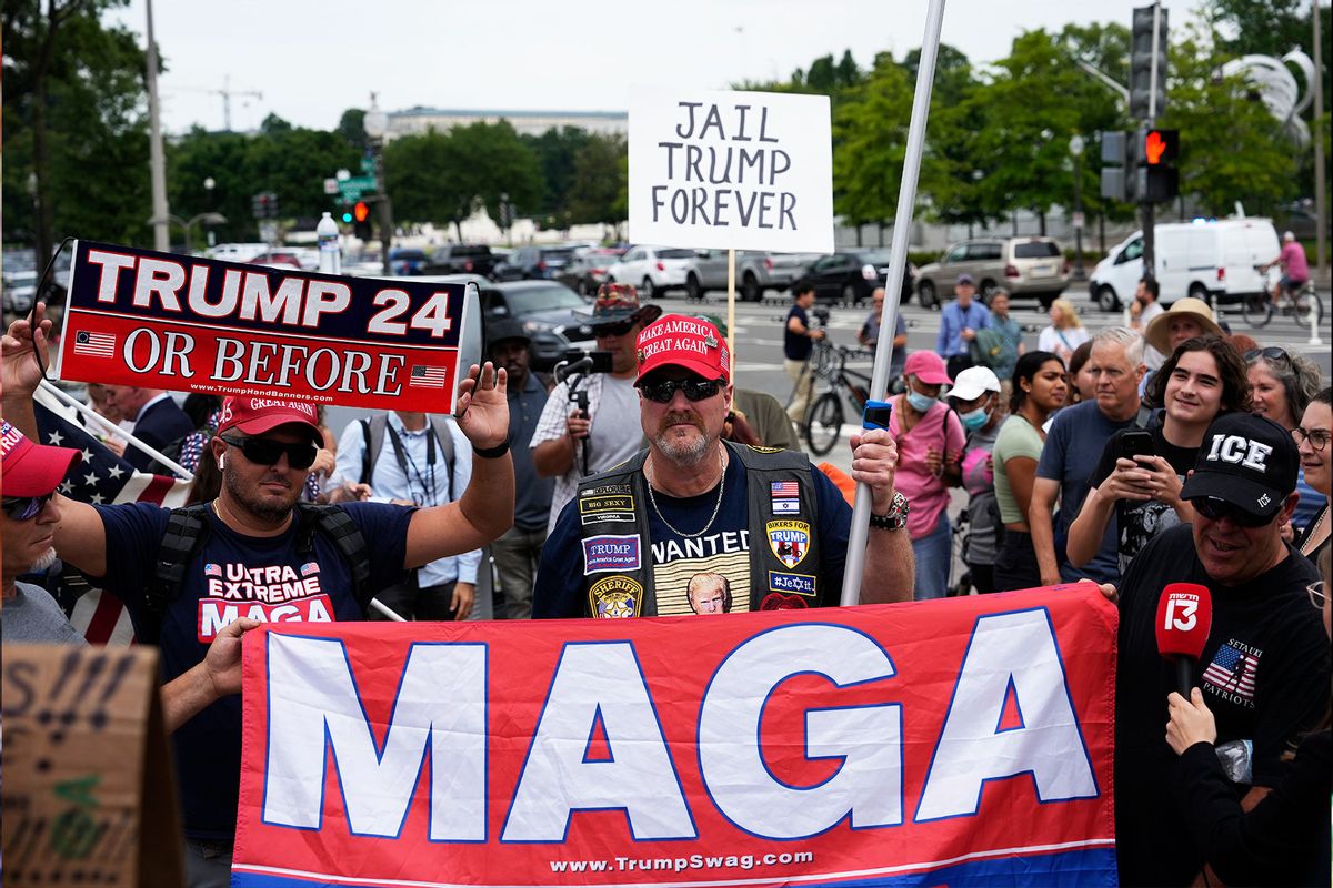 Supporters of former U.S. President Donald Trump hold signs as they demonstrate outside of the E. Barrett Prettyman U.S. Courthouse on August 03, 2023 in Washington, DC. (Drew Angerer/Getty Images)