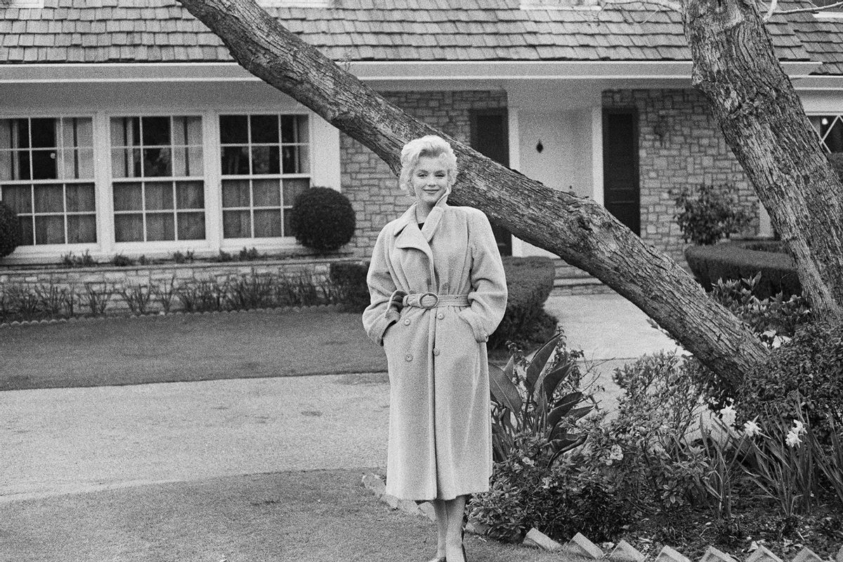 American actress Marilyn Monroe (1926 - 1962) poses outside her home during a photo call, California, USA, 1956. (Gene Lester/Getty Images)
