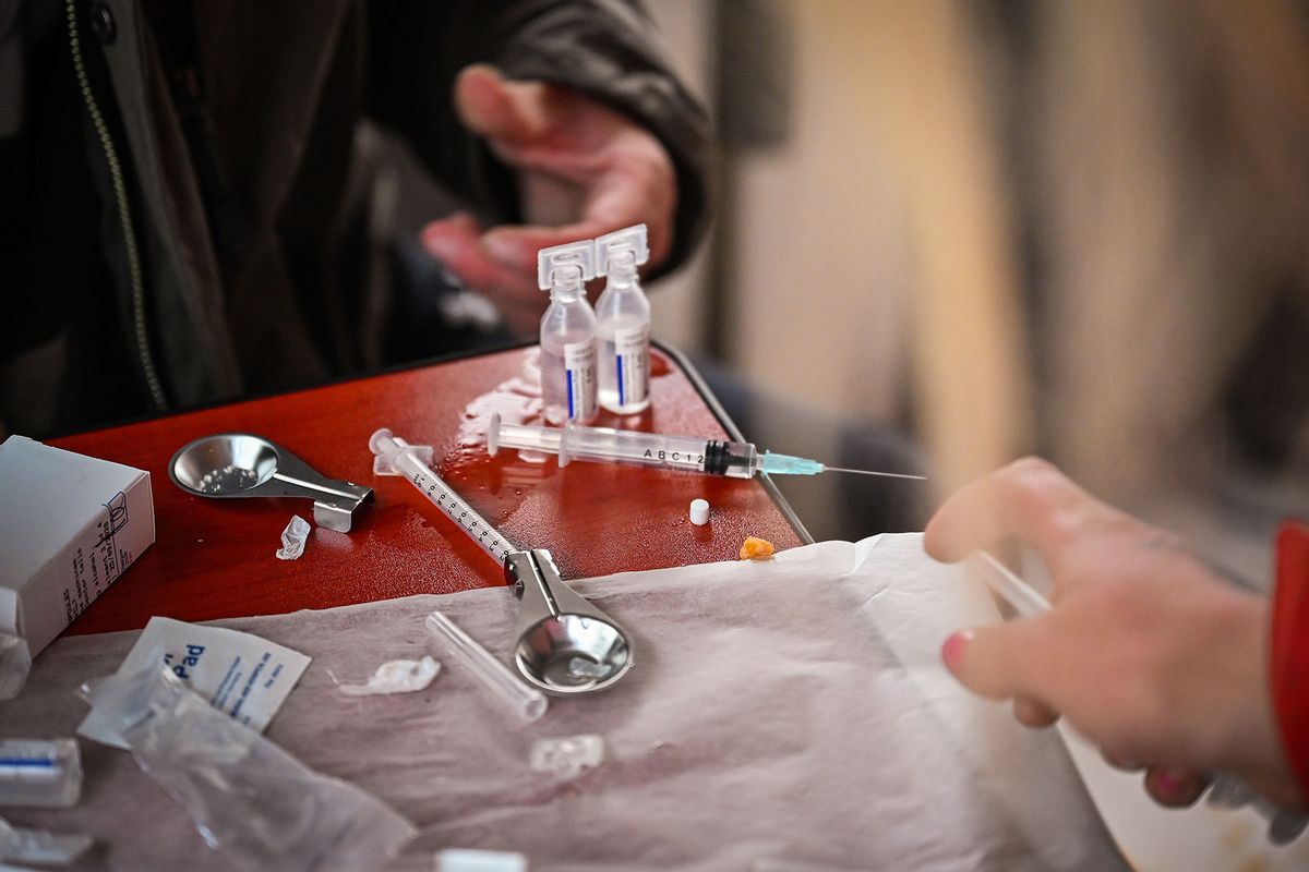 Drug users prepare cocaine before injecting, inside of a Safe Consumption van set up by Peter Krykant on September 25, 2020 in Glasgow, Scotland. (Jeff J Mitchell/Getty Images)