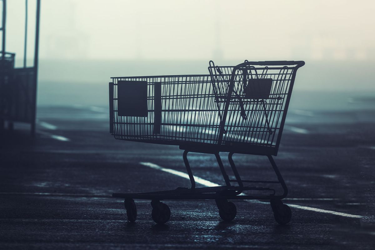 Shopping cart left behind in a parking lot (Getty Images/shaunl)