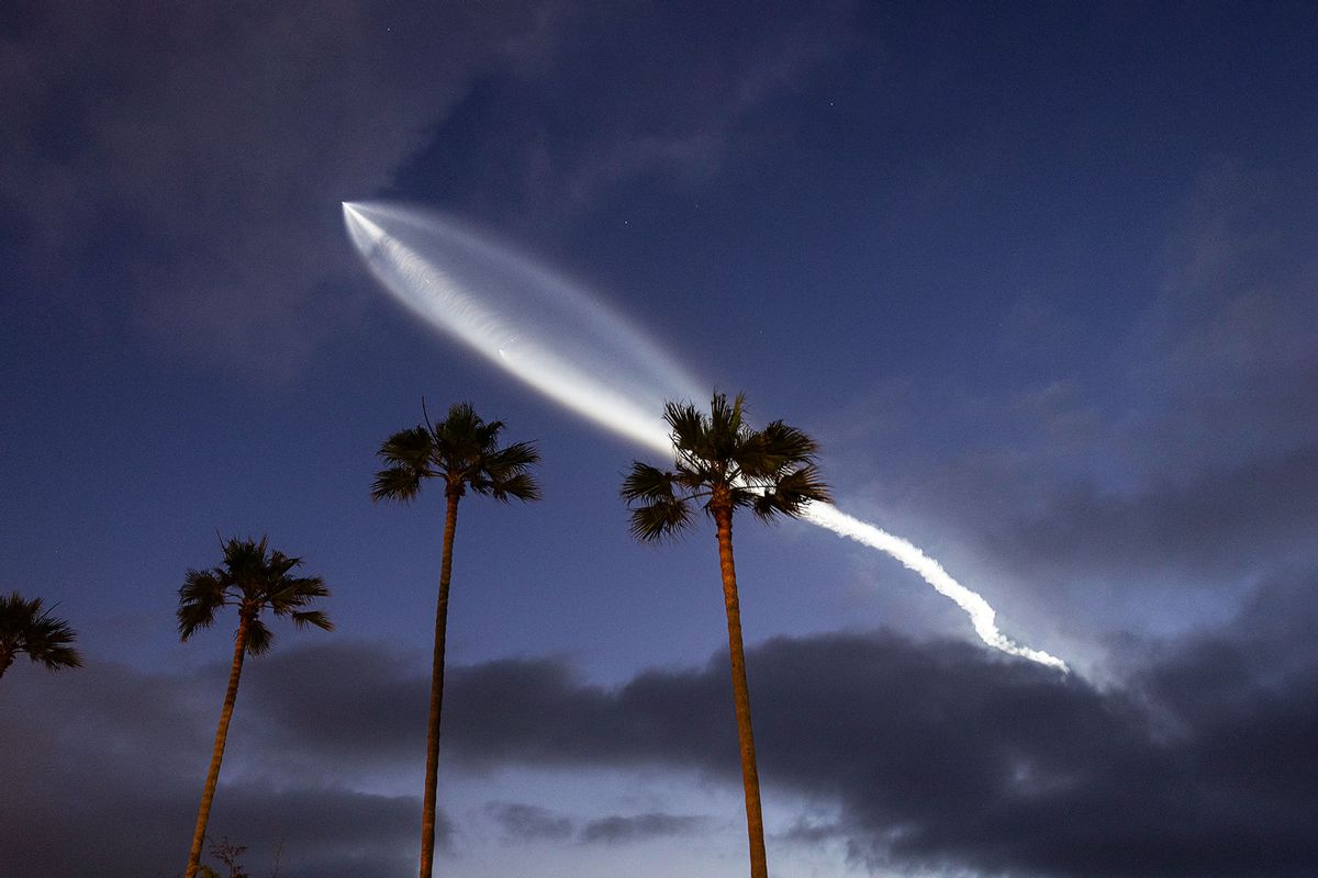 A SpaceX Falcon 9 rocket carrying a payload of 20 Starlink internet satellites into space soars across the sky after sunset above the Pacific Ocean after launching from Vandenberg Space Force Base on June 18, 2024, as seen from San Diego, California. (Kevin Carter/Getty Images)