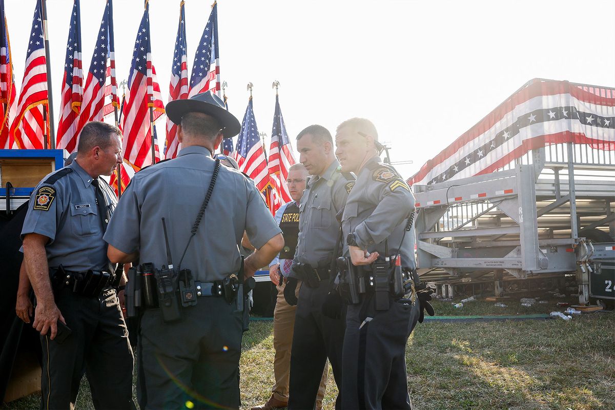 Law enforcement agents stand near the stage of a campaign rally for Republican presidential candidate former President Donald Trump on July 13, 2024 in Butler, Pennsylvania. (Anna Moneymaker/Getty Images)