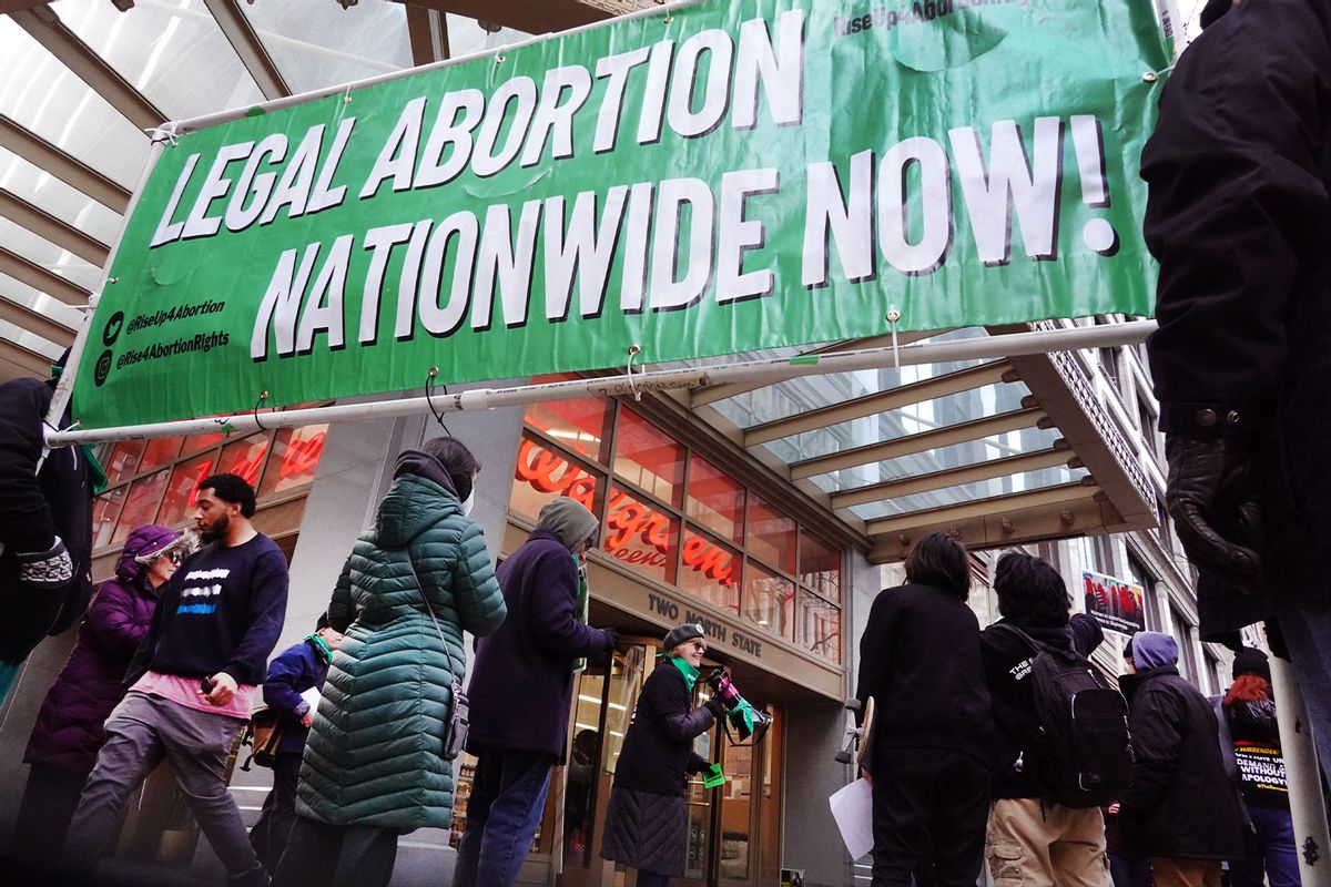 Demonstrators marching through downtown advocating for a woman's right to an abortion stop to protest in front of a Walgreen's store on March 08, 2023 in Chicago, Illinois. (Scott Olson/Getty Images)