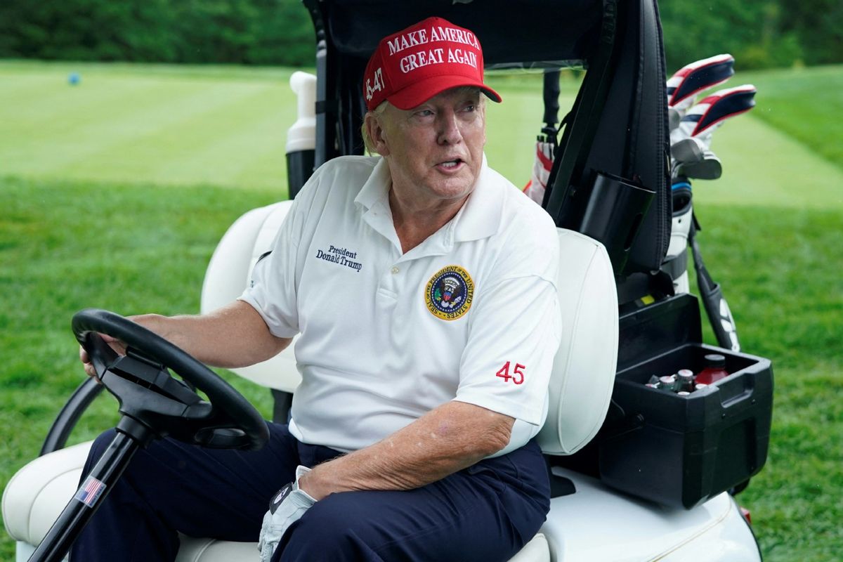Former U.S. President and 2024 Presidential hopeful Donald Trump drives a golf cart during the Official Pro-Am Tournament ahead of the LIV Golf Invitational Series event at Trump National Golf Club Bedminster in Bedminster, New Jersey, on August 10, 2023. (TIMOTHY A. CLARY/AFP via Getty Images)
