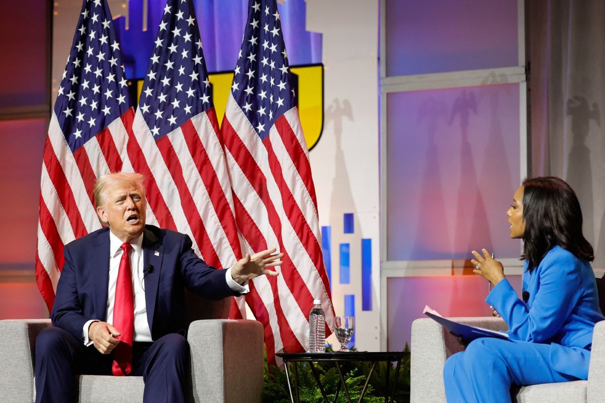 Former U.S. President and 2024 Republican presidential nominee Donald Trump answers questions as moderator and journalist Rachel Scott (R) looks on during the National Association of Black Journalists annual convention in Chicago, Illinois, on July 31, 2024.  (KAMIL KRZACZYNSKI/AFP via Getty Images)