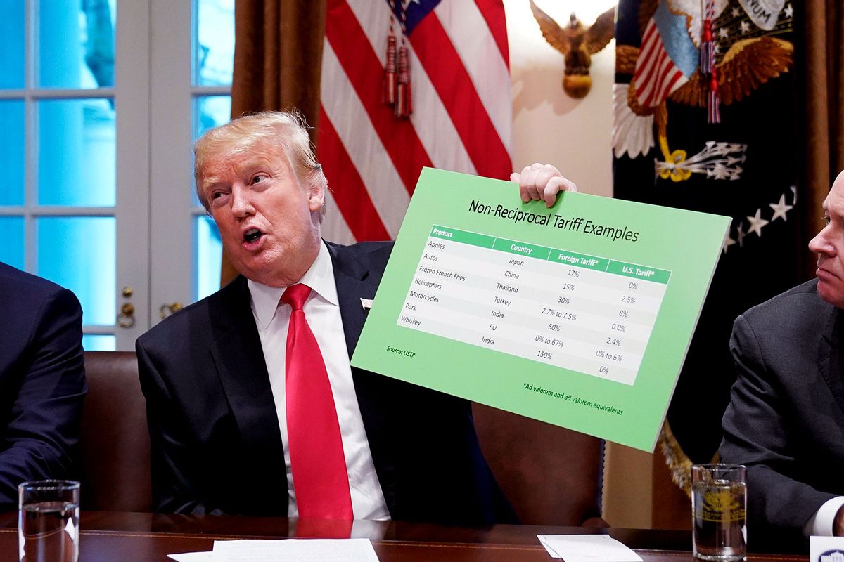 US President Donald Trump holds a tariff table as he speaks in the Cabinet Room of the White House on January 24, 2019. (MANDEL NGAN/AFP via Getty Images)