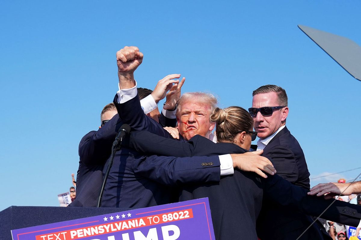 mer president Donald Trump raises his arm with blood on his face during a campaign rally for former President Donald Trump at Butler Farm Show Inc. on Saturday, July 13, 2024 in Butler, Pa. (Jabin Botsford/The Washington Post via Getty Images)