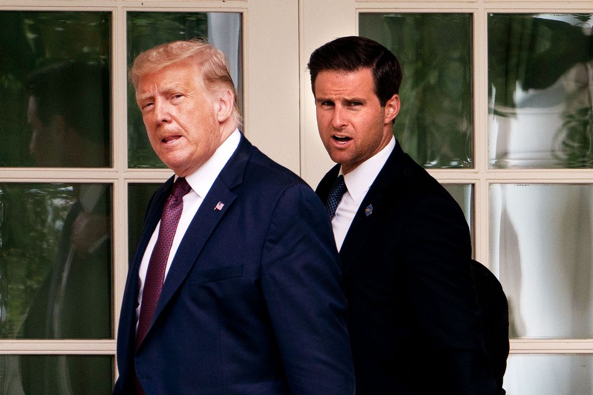 US President Donald Trump, with Director of the White House Presidential Personnel Office John McEntee, walks to the Oval Office as he returns to the White House in Washington, DC, on September 11, 2020. (ANDREW CABALLERO-REYNOLDS/AFP via Getty Images)
