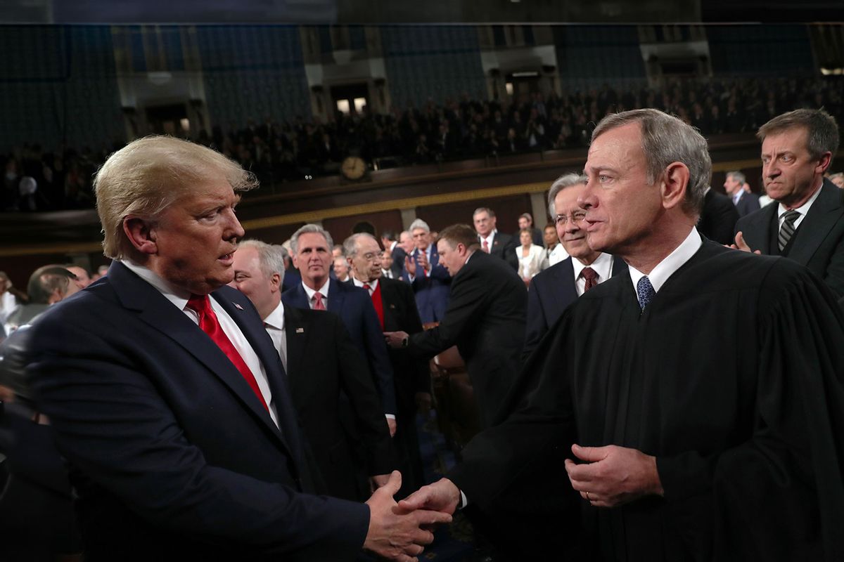 U.S. President Donald Trump shakes hands with Supreme Court Chief Justice John Roberts before the State of the Union address in the House chamber on February 4, 2020 in Washington, DC. (Leah Millis-Pool/Getty Images)
