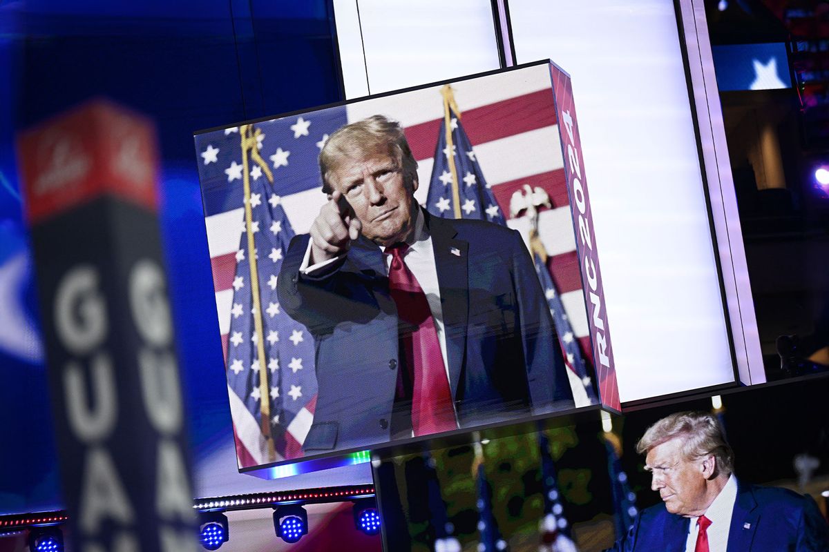 Images of Donald Trump appear on stage screens in the Fiserv Forum on the day before the Republican National Convention (RNC) on July 14, 2024, in Milwaukee, Wisconsin. (Leon Neal/Getty Images)