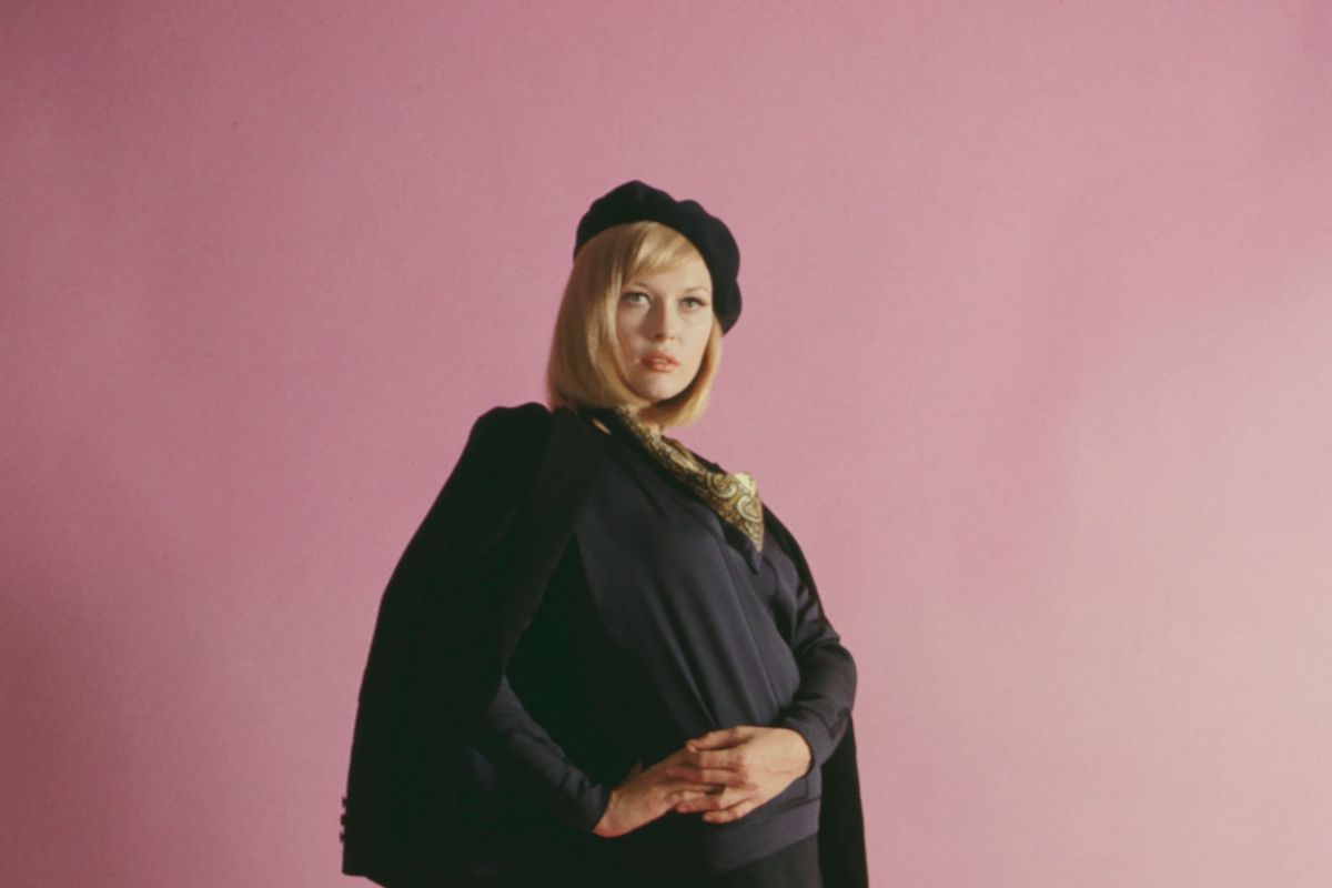 Portrait of American actress Faye Dunaway (in costume as Bonnie Parker) as she poses before a pink background for 'Bonnie and Clyde' (directed by Arthur Penn), 1967. (Silver Screen Collection/Getty Images)