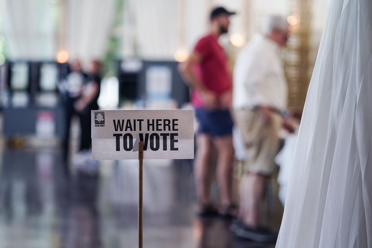 A 'Wait Here To Vote' sign is seen in a polling location as voters check in to cast ballots on May 21, 2024 in Atlanta, Georgia. (Elijah Nouvelage/Getty Images)