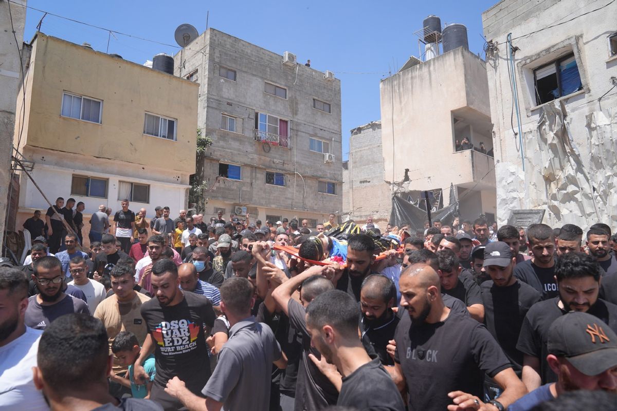 Families and loved ones of the Palestinians who lost their lives after Israeli attacks on Nur Shams Refugee Camp attend their funeral ceremony in Tulkarm, West Bank on July 03, 2024. (Issam Rimawi/Anadolu via Getty Images)