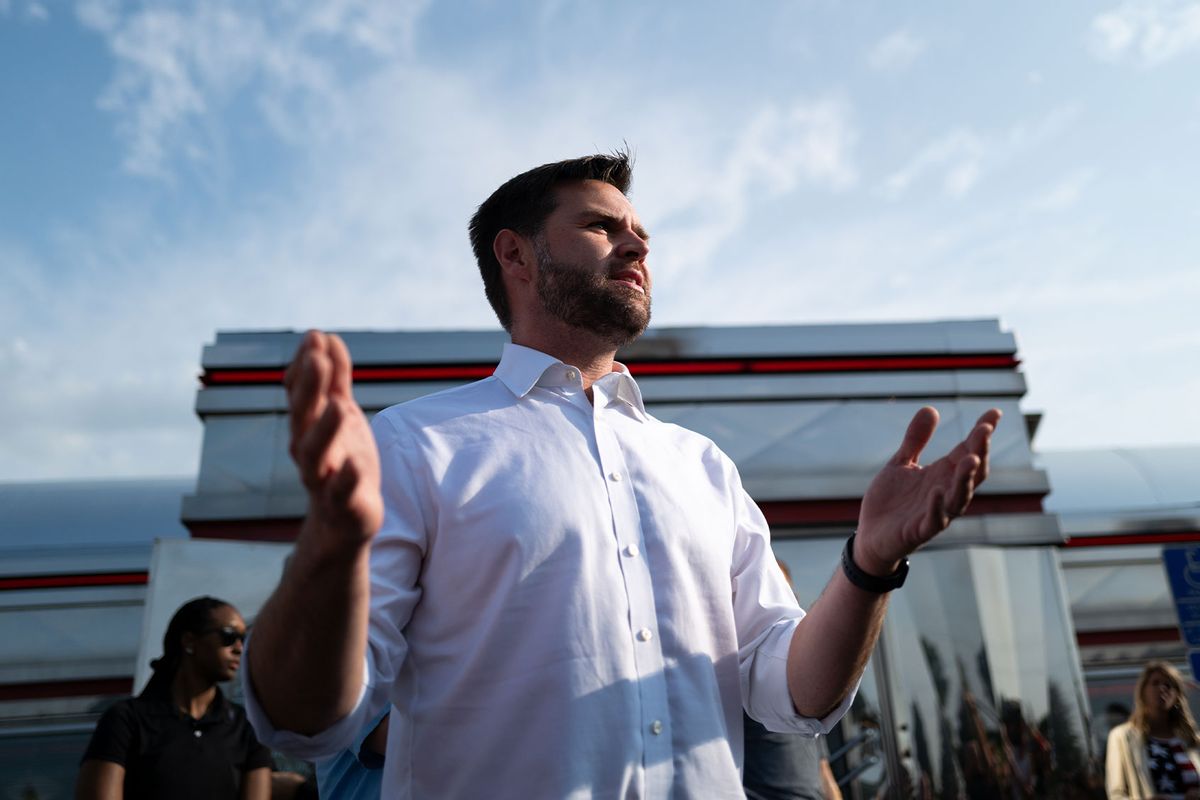 Republican vice presidential nominee U.S. Sen. J.D. Vance (R-OH) speaks with media gathered outside the Park Diner on July 28, 2024 in St Cloud, Minnesota. (Stephen Maturen/Getty Images)