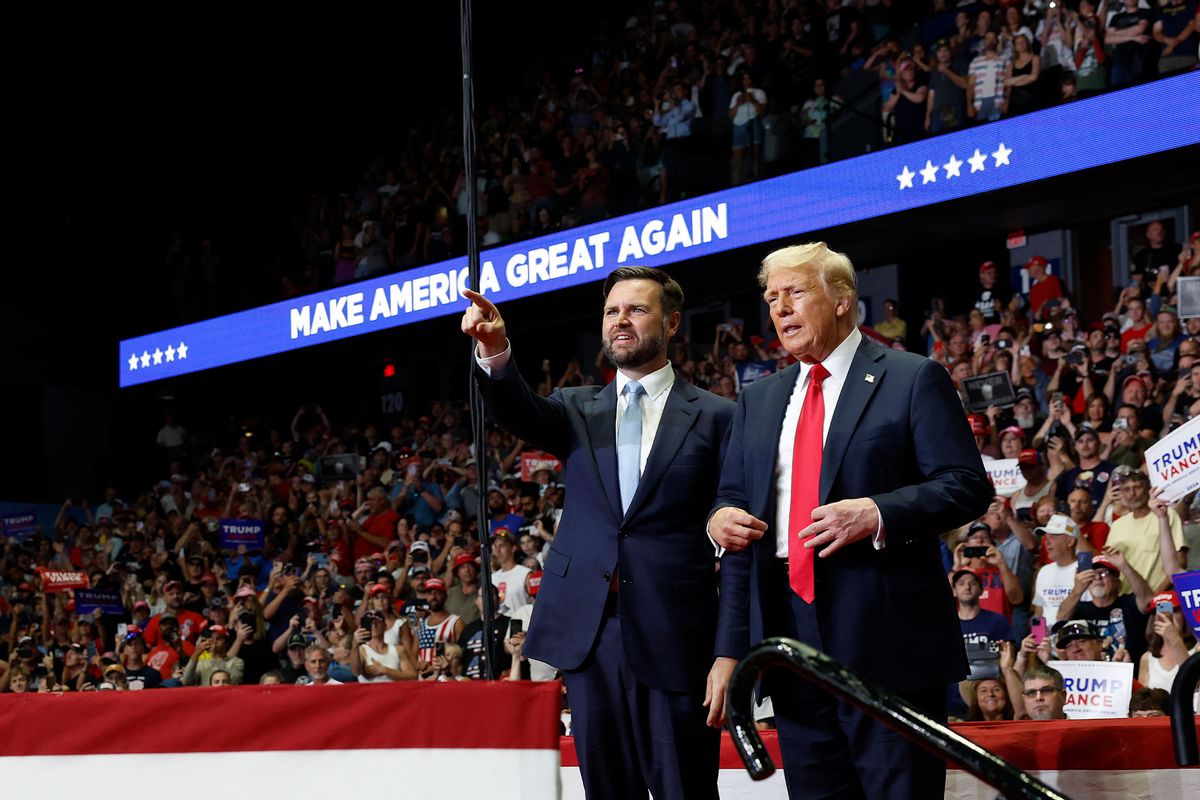 Republican presidential nominee, former U.S. President Donald Trump stands onstage with Republican vice presidential candidate, Sen. J.D. Vance (R-OH) during a campaign rally at the Van Andel Arena on July 20, 2024 in Grand Rapids, Michigan. (Anna Moneymaker/Getty Images)