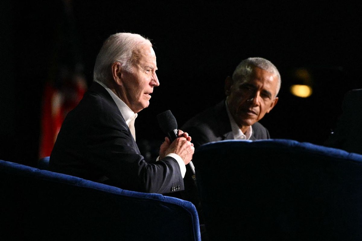 U.S. President Joe Biden (L) speaks next to former US President Barack Obama onstage during a campaign fundraiser at the Peacock Theater in Los Angeles on June 15, 2024.  (MANDEL NGAN/AFP via Getty Images)