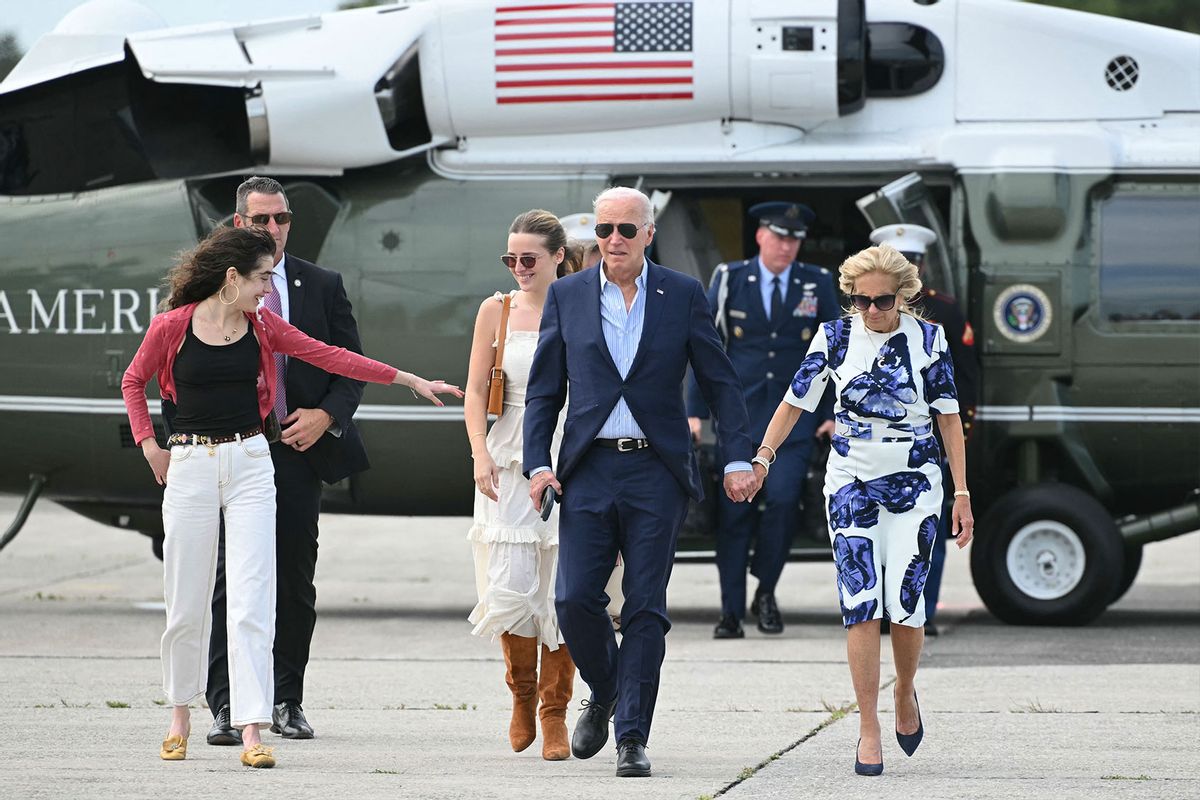 US President Joe Biden and First Lady Jill Biden, along with granddaughters Natalie (L) and Finnegan (2nd L), walk from Marine One to board Air Force One at Francis S. Gabreski Airport in Westhampton Beach, New York on June 29, 2024. (MANDEL NGAN/AFP via Getty Images)