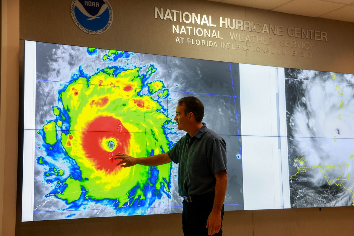 John Cangialosi, Senior Hurricane Specialist at the National Hurricane Center, inspects a satellite image of Hurricane Beryl, the first hurricane of the 2024 season, at the National Hurricane Center on July 01, 2024 in Miami, Florida. (Joe Raedle/Getty Images)