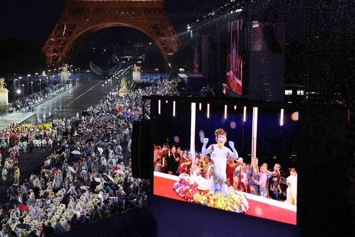 Delegations arrive at the Trocadero as spectators watch French singer Philippe Katerine performing on a giant screen during the Opening Ceremony of the Olympic Games Paris 2024 on July 26, 2024 in Paris, France. (Ludovic Marin - Pool/Getty Images)