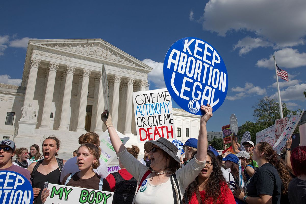 Women are showing signs when the abortion rights activists are protesting in front of the US Supreme Court in Washington, DC on June 24, 2024. (AASHISH KIPHAYET/Middle East Images/AFP via Getty Images)