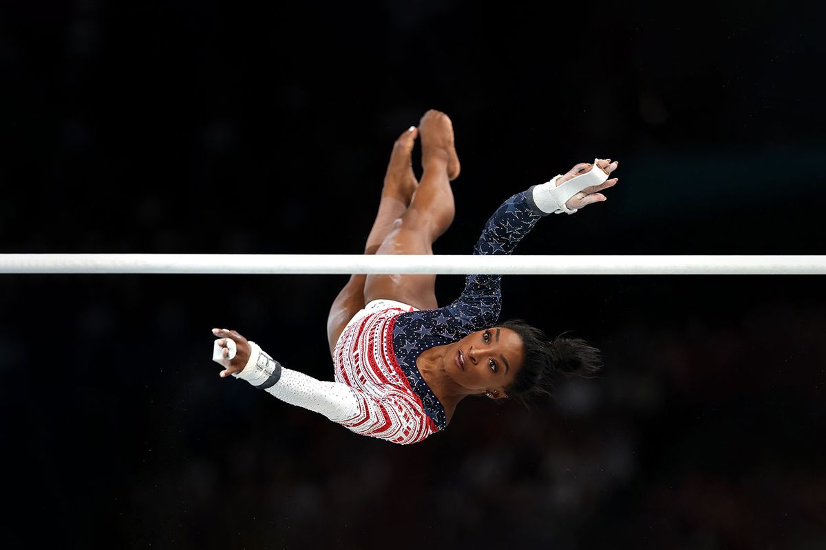 Simone Biles of Team United States competes on the uneven bars during the Artistic Gymnastics Women's Team Final on day four of the Olympic Games Paris 2024 at Bercy Arena on July 30, 2024 in Paris, France. (Jamie Squire/Getty Images)