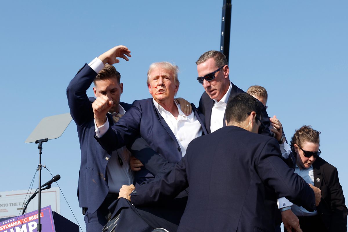 Former President Donald Trump is rushed offstage during a rally on July 13, 2024 in Butler, Pennsylvania ( Anna Moneymaker/Getty Images)