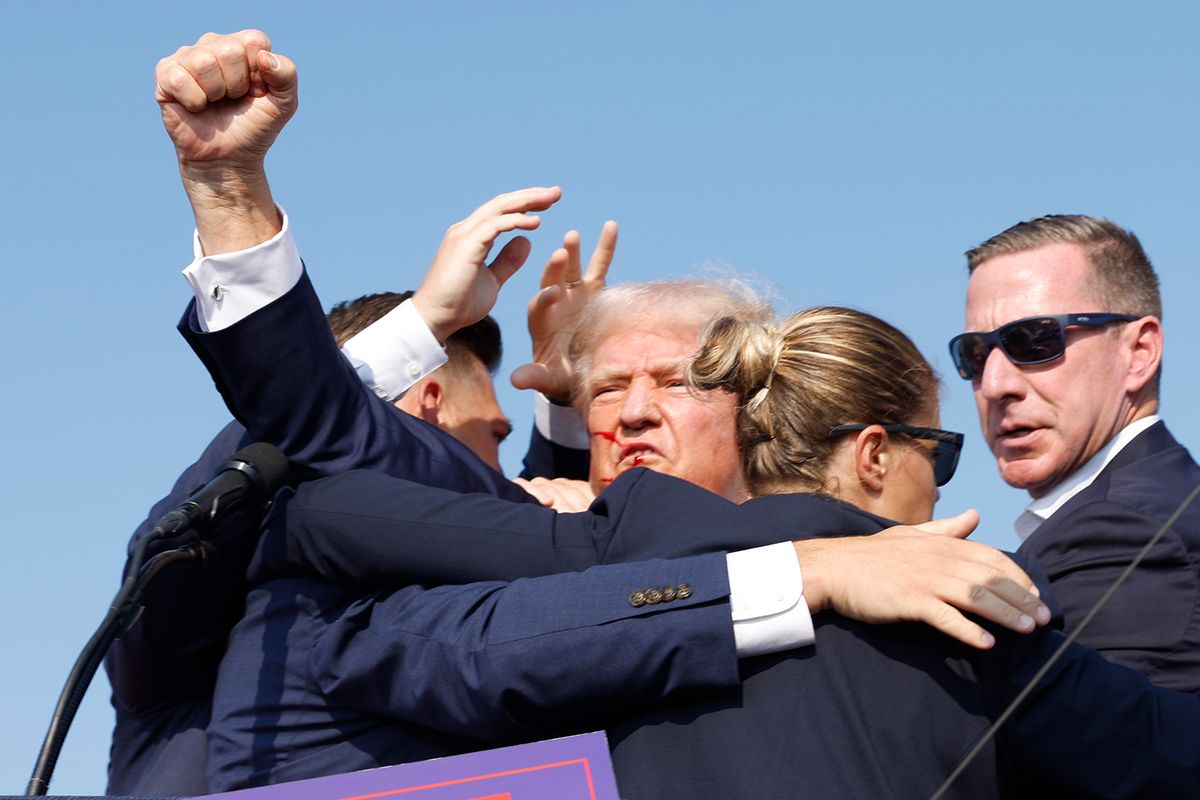 Former President Donald Trump is rushed offstage during a rally on July 13, 2024 in Butler, Pennsylvania (Anna Moneymaker/Getty Images)