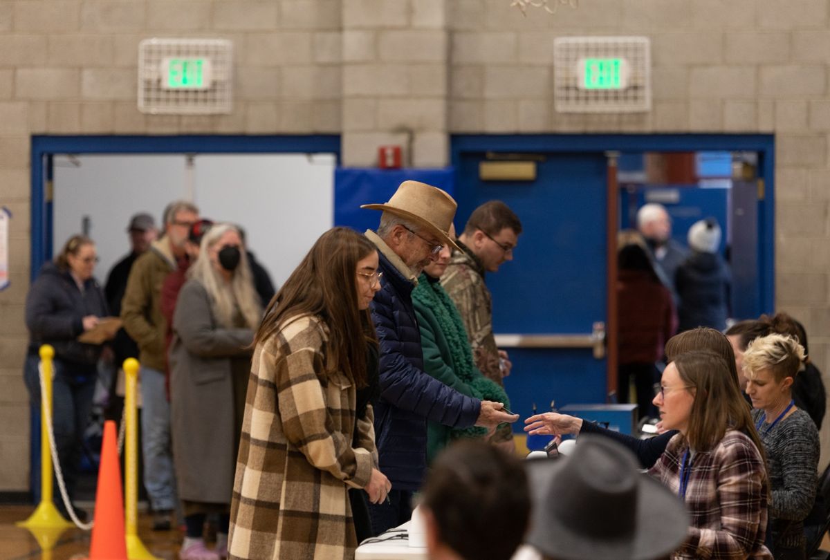 Voters stand in line to check in before casting their ballots at Reno High School in Washoe County on November 8, 2022 in Reno, Nevada. (Trevor Bexon/Getty Images)