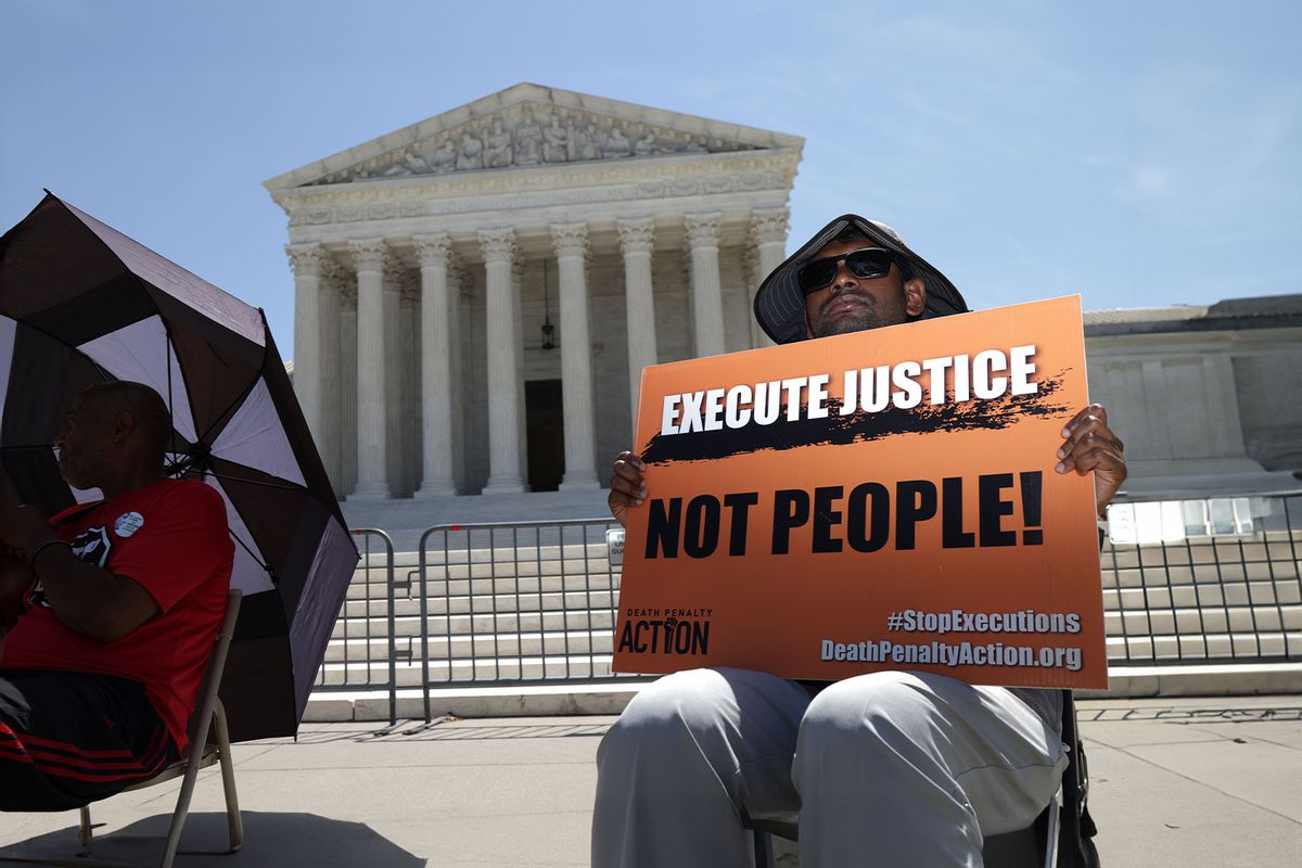 Sunny Neelam of Catholic Worker House holds a sign that reads “Execute Justice Not People!" as he participates in a vigil against the death penalty in front of the U.S. Supreme Court on June 29, 2021 in Washington, DC. (Alex Wong/Getty Images)