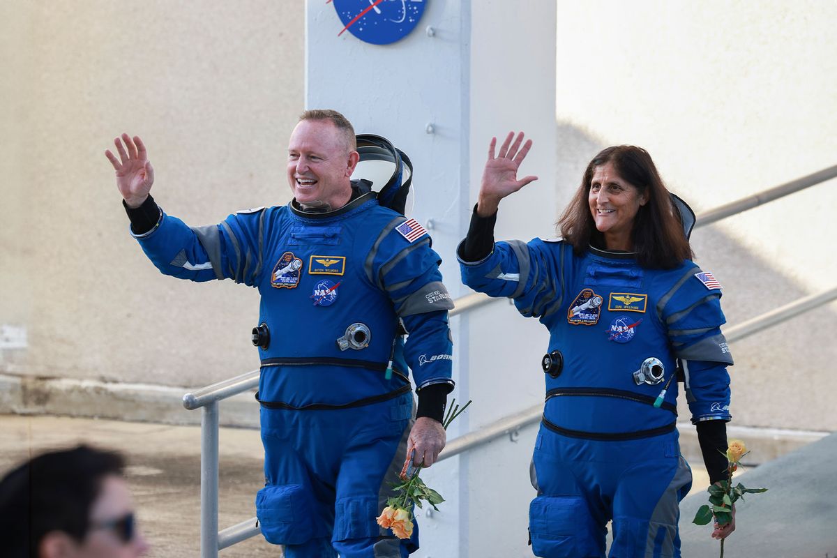 NASA’s Boeing Crew Flight Test Commander Butch Wilmore (L) and Pilot Suni Williams walk out of the Operations and Checkout Building on June 05, 2024 in Cape Canaveral, Florida. (Joe Raedle/Getty Images)