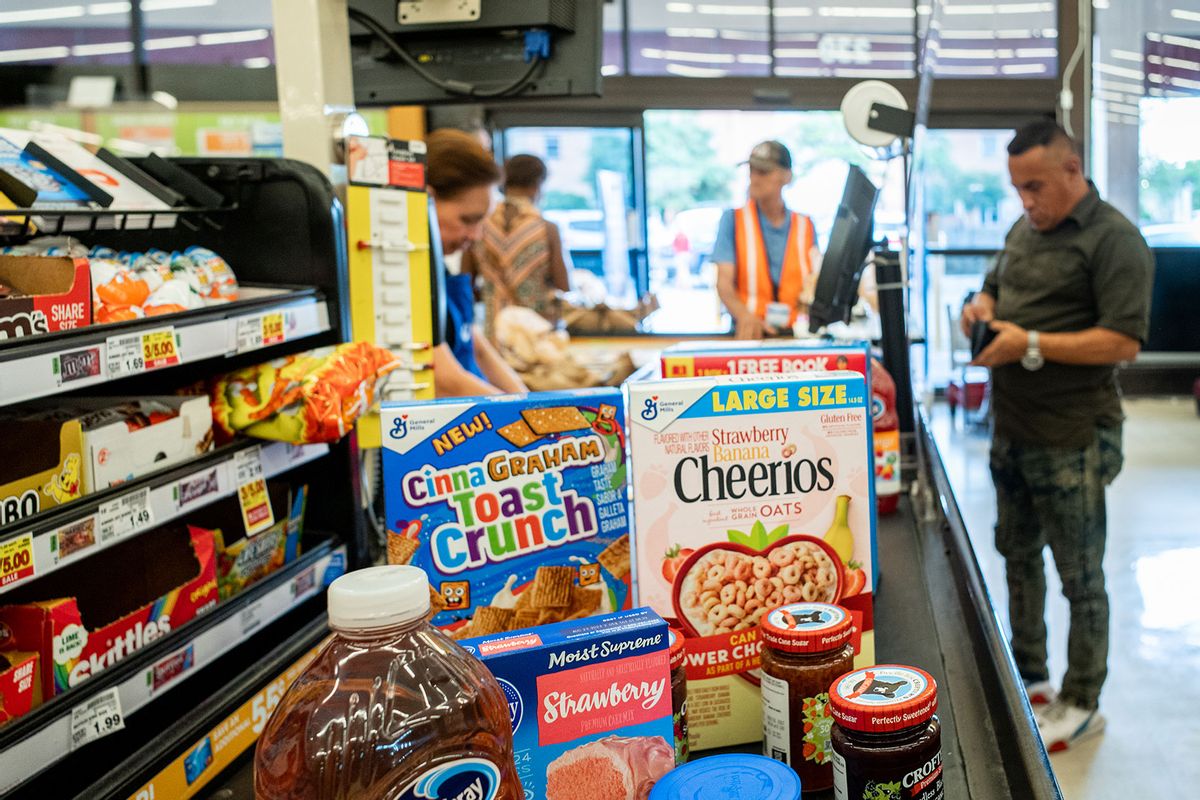 A cashier processes a customer's order in a Kroger grocery store on July 15, 2022 in Houston, Texas. (Brandon Bell/Getty Images)