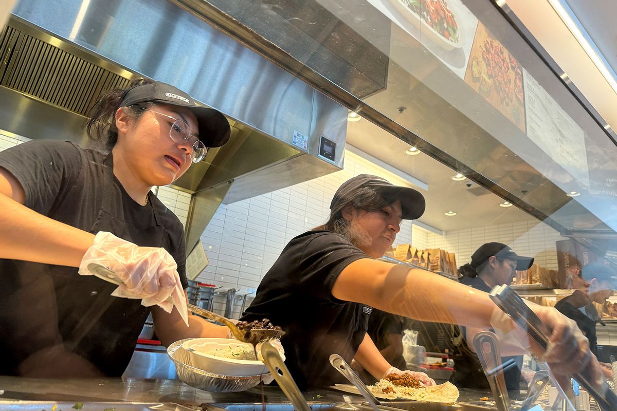 Workers fill food orders at a Chipotle restaurant on April 01, 2024 in San Rafael, California. (Justin Sullivan/Getty Images)