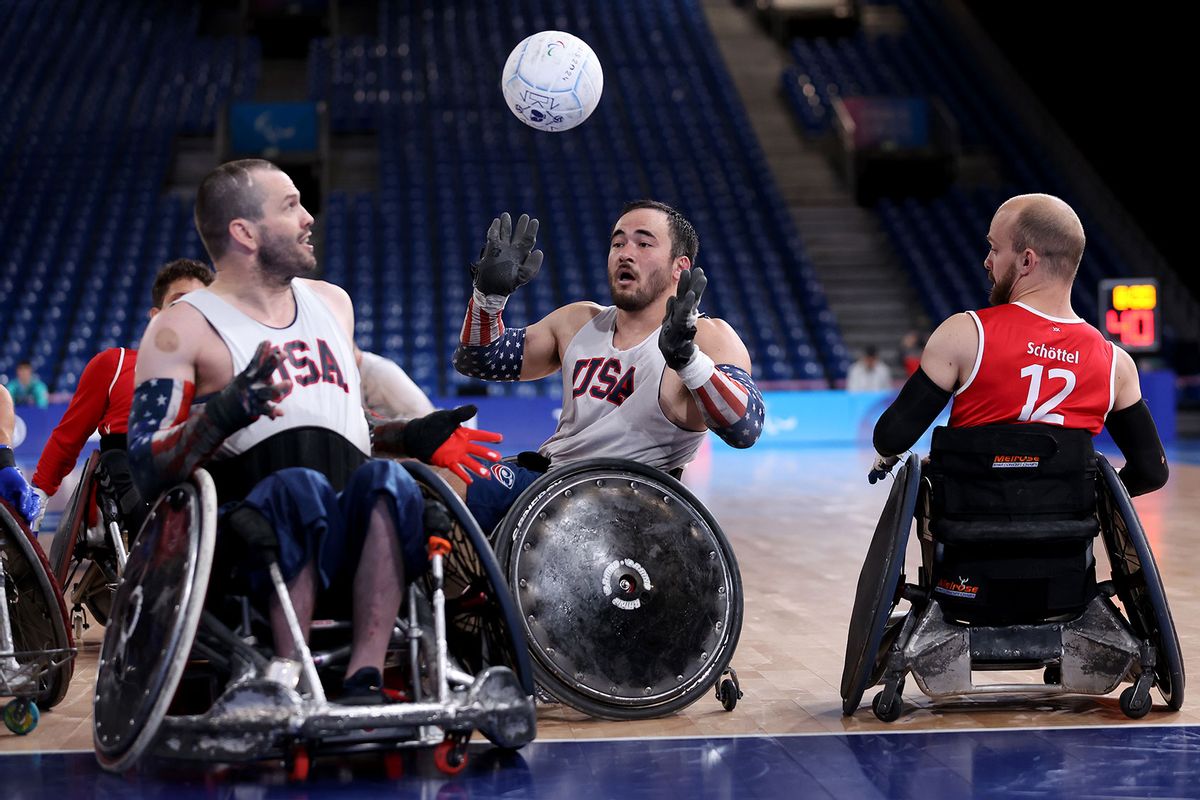 Chuck Aoki passes to Josh Wheeler of Team United States during a wheelchair rugby scrimmage against Team Denmark ahead of the Paris 2024 Summer Paralympic Games at Champs-de-Mars Arena on August 25, 2024 in Paris, France. (Ezra Shaw/Getty Images)