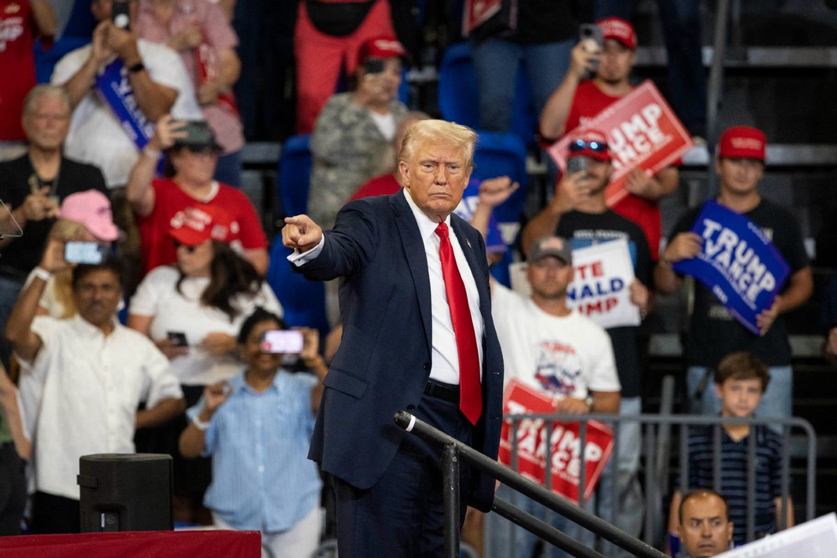 Former U.S. President and 2024 Republican presidential candidate Donald Trump points to the crowd as he leaves after speaking during a campaign rally at the Georgia State University Convocation Center in Atlanta, Georgia, on August 3, 2024.  (CHRISTIAN MONTERROSA/AFP via Getty Images)