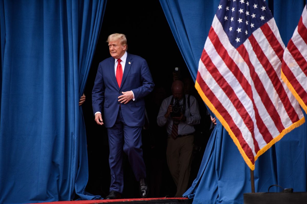 Republican Presidential candidate, former U.S. president, Donald Trump, takes the stage to offer remarks to a crowd during an event on August 21, 2024 in Asheboro, North Carolina at the North Carolina Aviation Museum and Hall of Fame.  (Melissa Sue Gerrits/Getty Images)