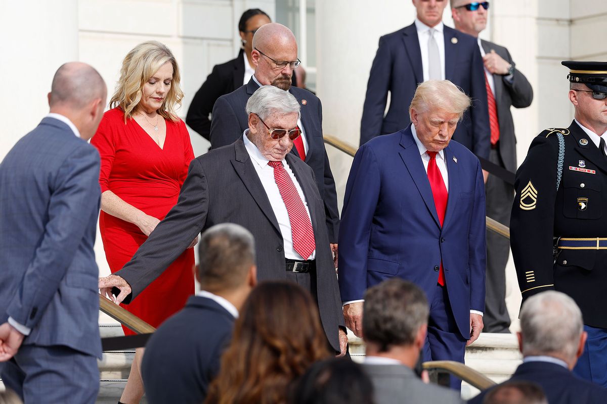 Republican presidential nominee, former U.S. President Donald Trump stands alongside Bill Barnett (L), who's grandson Staff Sgt Darin Taylor Hoover died in Abbey Gate Bombing, during a wreath laying ceremony at the Tomb of the Unknown Soldier at Arlington National Cemetery on August 26, 2024 in Arlington, Virginia. (Anna Moneymaker/Getty Images)