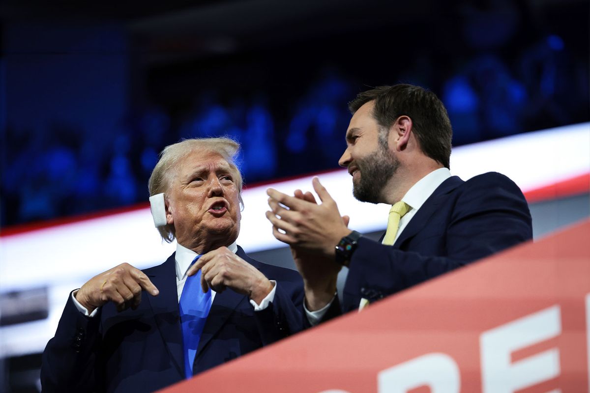 Republican presidential candidate, former U.S. President Donald Trump speaks with Republican vice presidential candidate, U.S. Sen. J.D. Vance (R-OH) on the second day of the Republican National Convention at the Fiserv Forum on July 16, 2024 in Milwaukee, Wisconsin. (Win McNamee/Getty Images)