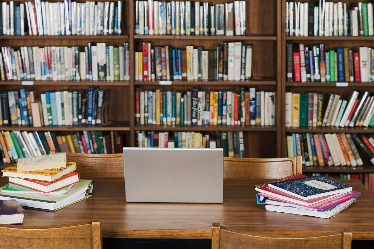 Empty chairs and table in library (Getty Images/Alberto Guglielmi)