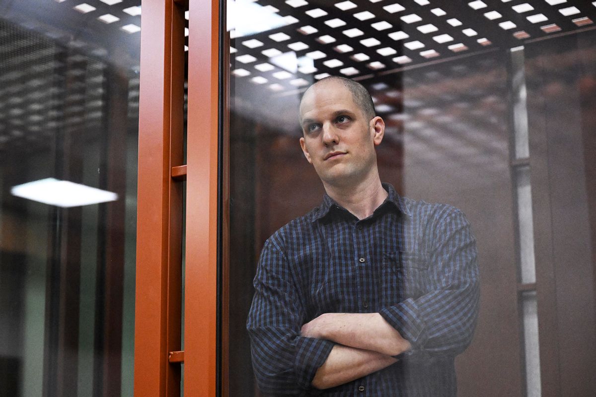 US journalist Evan Gershkovich, accused of espionage, looks out from inside a glass defendants' cage prior to a hearing in Yekaterinburg's Sverdlovsk Regional Court on June 26, 2024. (NATALIA KOLESNIKOVA/AFP via Getty Images)