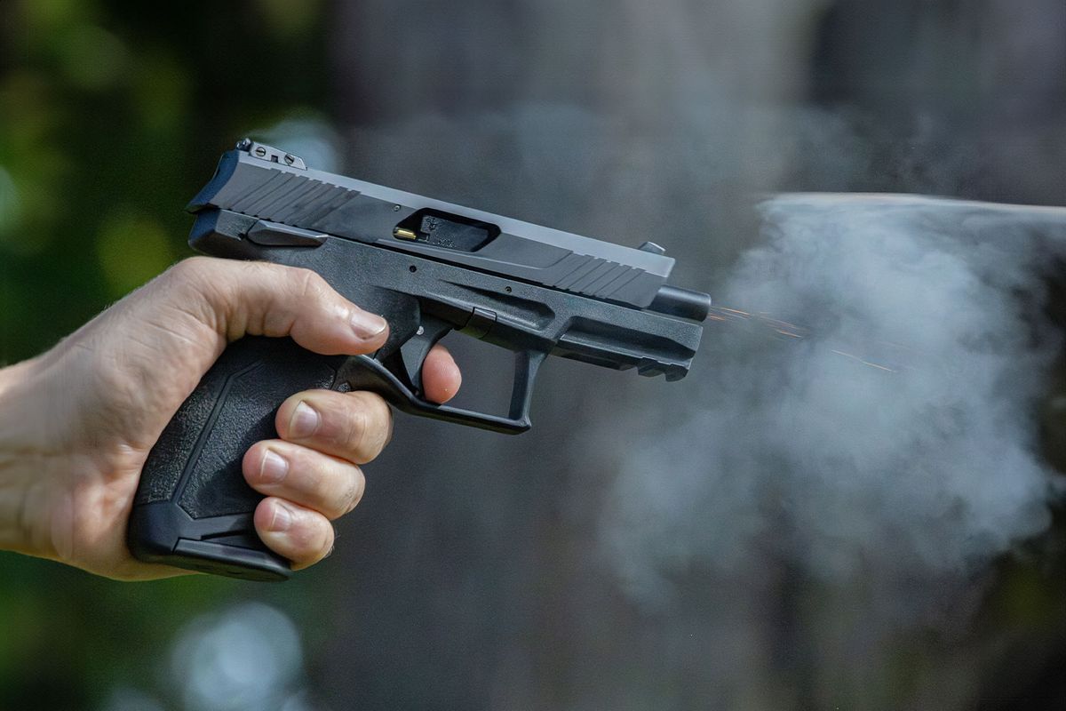 A .22 pistol firing at a target. (Getty Images/Jesse Bacon)