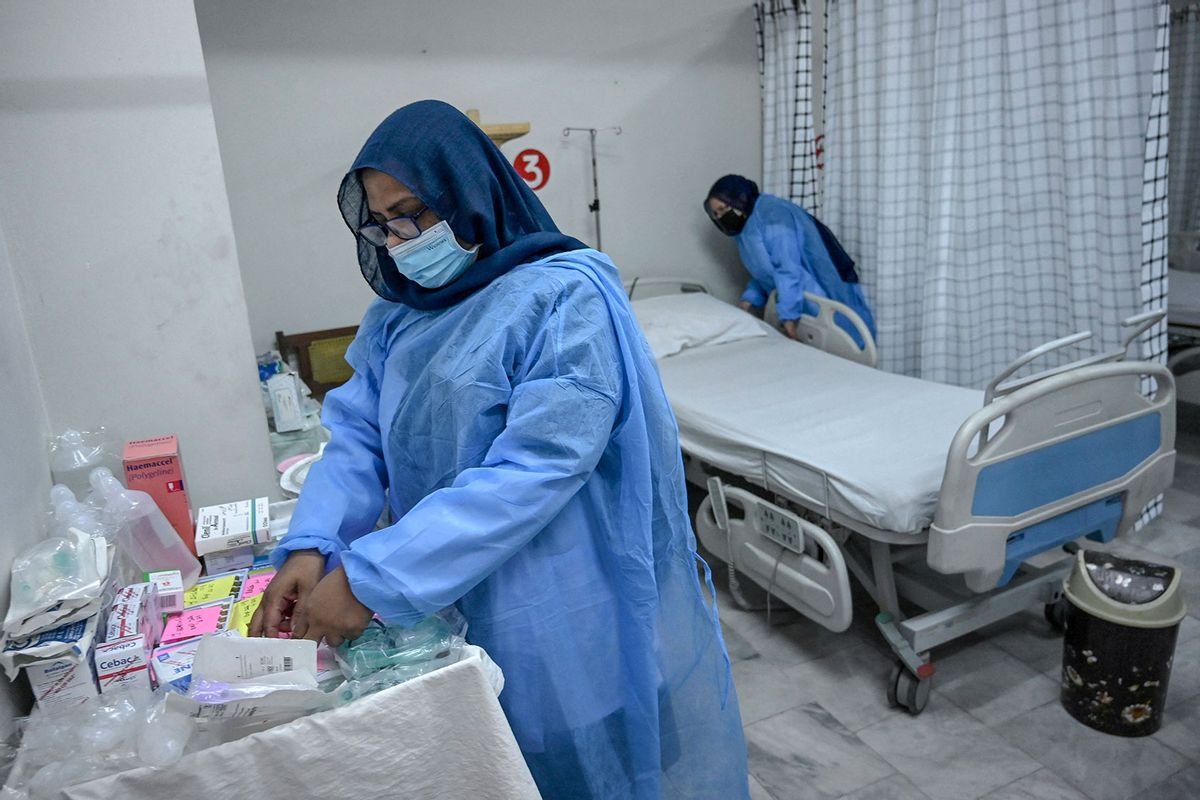 Health workers prepare an isolation ward for mpox patients at the Police and Services hospital in Peshawar, Pakistan on August 20, 2024. (ABDUL MAJEED/AFP via Getty Images)