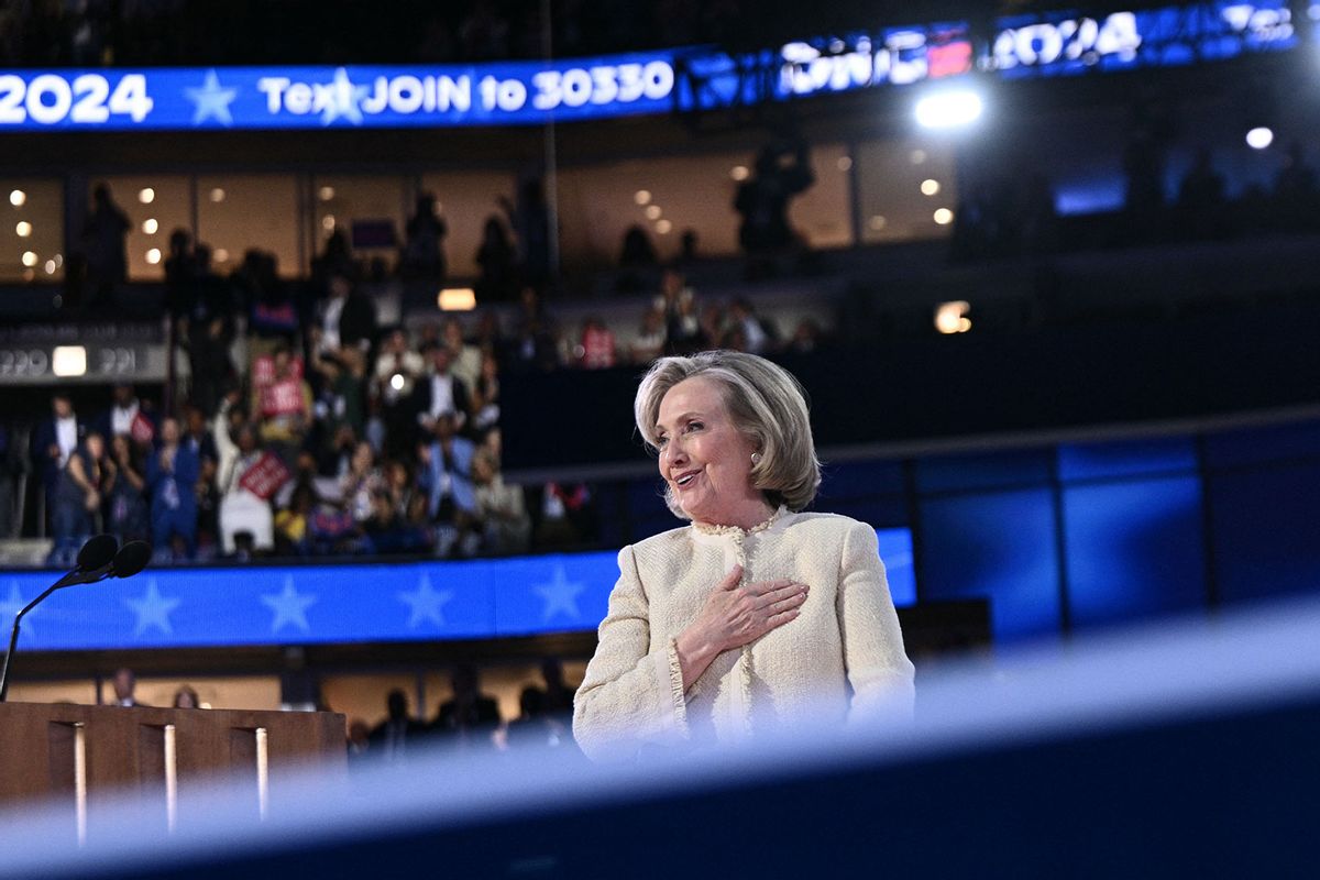 Former US Secretary of State Hillary Clinton salutes the attendees as she steps off stage after speaking on the first day of the Democratic National Convention (DNC) at the United Center in Chicago, Illinois, on August 19, 2024. (BRENDAN SMIALOWSKI/AFP via Getty Images)