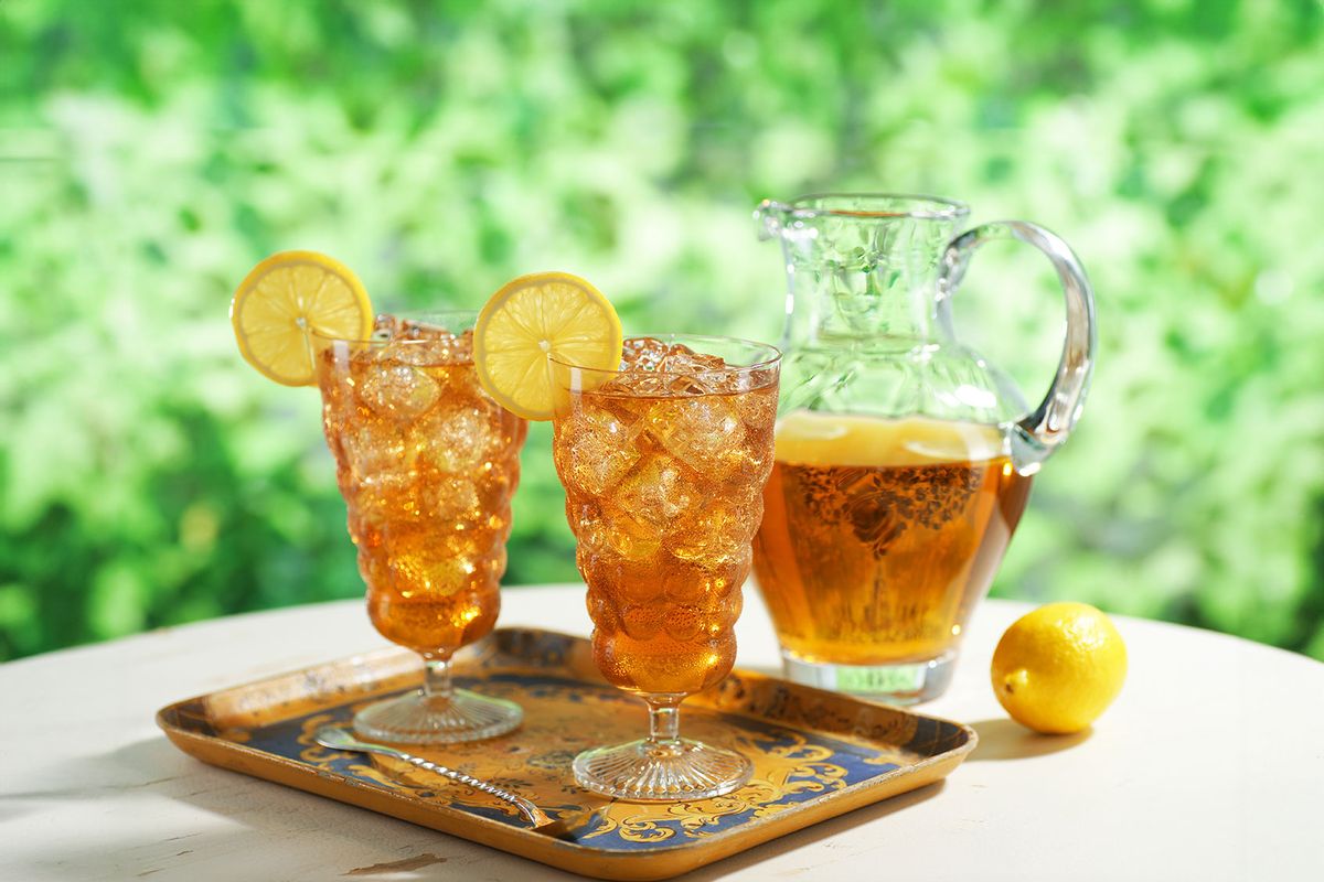 Two glasses of iced tea with pitcher. (Getty Images/TheCrimsonMonkey)