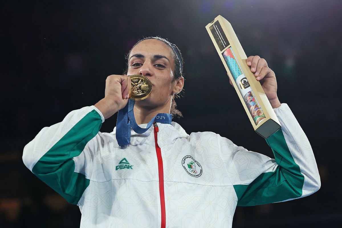 Gold Medallist Imane Khelif of Team Algeria kisses her medal during the Boxing Women's 66kg medal ceremony after the Boxing Women's 66kg Final match on day fourteen of the Olympic Games Paris 2024 at Roland Garros on August 09, 2024, in Paris, France.  (Richard Pelham/Getty Images)