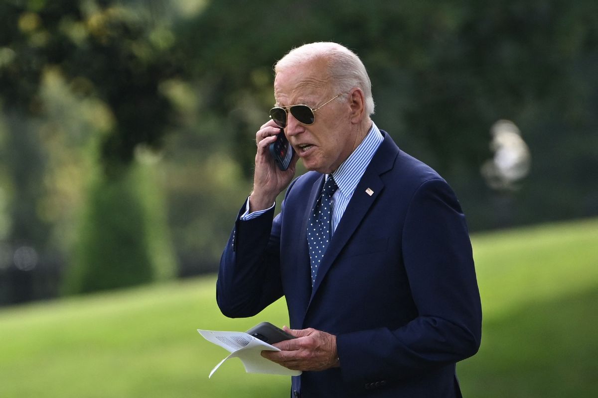 US President Joe Biden takes a phone call as he walks to board Marine One from the South Lawn of the White House in Washington, DC, on August 16, 2024.  (ANDREW CABALLERO-REYNOLDS/AFP via Getty Images)